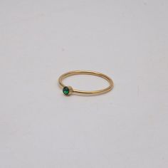 Cute and tiny, this thin ring comes with a little round green stone. It is perfect for everyday wear. Style with our Green Up Ring. 18k gold plated Stainless steel base Waterproof and tarnish free Available in US 6-8 Dot Ring, Blue Sapphire Gemstone, Bar Ring, Black Bar, Green Dot, Enamel Ring, Cz Ring, Onyx Ring, Original Gift