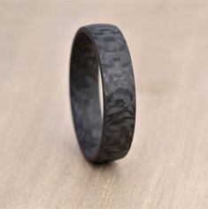 a black ring with camouflage print on it