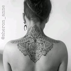 a woman with a tattoo on her back