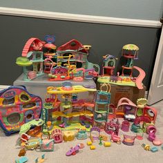 a pile of toys sitting on top of a floor