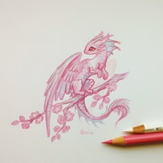 a drawing of a pink dragon with flowers and leaves on it's back, next to a red pencil