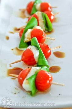 small appetizers with tomatoes and cheese on skewers