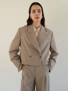 Editor's notesThis cropped suit jacket with a peaked collar feels nothing as heavy as your normal mid-length blazer. - Summer wool material- Cropped length jacket- Peaked collar, one-button detail- Shoulder pad- Fully lined- Set up with Layered belt wide trouser by MOHANMeasurements(in.)- Size: S, M- Shoulder: 17.52in / 18.11in    - Chest: 20.87in / 21.85in- Hem: 20.67in / 21.65in  - Sleeve: 24.41in / 24.61in- Length: 19.29in / 19.49in- Model size: 5' 6 / Bust: 31.5in / Waist: 23.5in / Hip: 34in and wearing a size SmallComposition & Care- 50% Polyester, 50% Wool- Dry clean onlyDesigner- by MOHAN Formal Cropped Outerwear With Double-breasted Button, Formal Cropped Blazer With Double-breasted Button Fastening, Office Cropped Jacket With Double Button Closure, Cropped Office Jacket With Double Button Closure, Classic Cropped Business Blazer, Formal Double-breasted Cropped Jacket, Classic Double-breasted Cropped Jacket For Work, Tailored Double-breasted Cropped Jacket For Formal Occasions, Tailored Cropped Jacket With Notch Lapel For Semi-formal Occasions