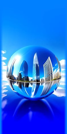 an image of a shiny blue ball with buildings in it's reflection on the water