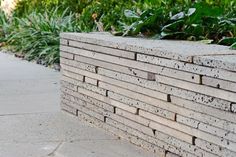 a close up of a brick wall on a sidewalk