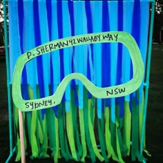 a blue and green sign with glasses on it that says p - shem'll always way