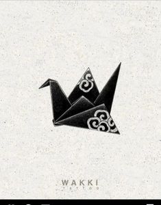 an origami bird with the word waki on it's back side