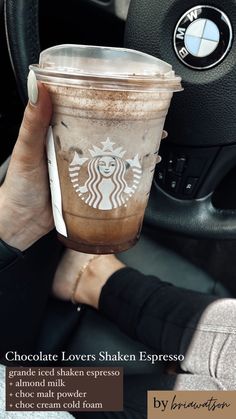 a woman holding up a cup of coffee in her hand with the words chocolate lover's shaken espresso on it