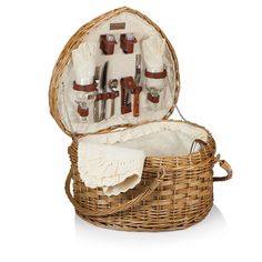 a wicker picnic basket with utensils in it