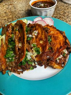 two pieces of fried food on a blue plate