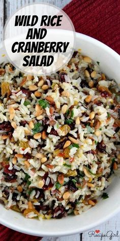 wild rice and cranberry salad in a white bowl on a red place mat