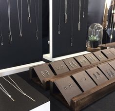 several necklaces are on display at a jewelry store