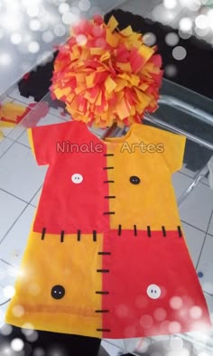 a child's dress made out of construction paper