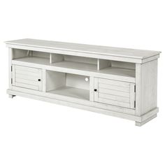 a white entertainment center with drawers and shelves