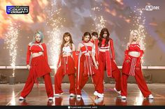 girls'generation performing on stage in red outfits