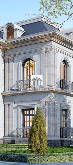 a large white building with two balconies on the second floor and an open balcony