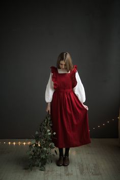 Victorian style apron with flutter sleeves is made from 100% soft and washed linen. Details: - Composition: 100% Oeko-Tex certified linen - Colour: red, black, white, natural - Cross back - Length - 124 cm (49 inches) - Adjustable with buttons - Size: One size - Light weight linen - Linen care: machine wash gentle; tumble dry low, ironing optional - The price is for one pinafore dress, other pictured items are not included Measurements: Length from waist down: 80 cm (31,4 in) Chest width: 24 cm Linen Pinafore Apron, Linen Pinafore, Natural Linen Dress, Apron For Women, Pinafore Apron, Vintage Apron, Mode Zara, Apron Kitchen, Iranian Women Fashion