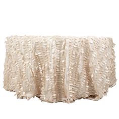 a white table cloth with ruffles on it