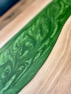 two green and white wood designs on top of each other