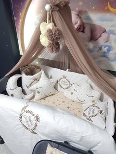 a baby crib with stuffed animals and pillows