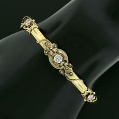 "This beautiful antique bangle bracelet was crafted from solid 14k yellow gold during the Victorian era and features a tube style with a gorgeous diamonds and seed pearls throughout its top. The fine diamonds show a nice size with the largest at the center, with all showing amazing brilliance and spectacular sparkles that are truly eye-catching on this bracelet.The stones sit on fine and open gold work designs that overlap the polished finish bracelet, adorned with adorable seed pearls throughou Victorian Gold Bracelet For Anniversary, Victorian 14k Gold Bangle, Vintage 14k Gold Diamond Bracelet, Antique 14k Gold Bangle, Vintage Yellow Gold Diamond Bracelet For Weddings, Vintage Hallmarked Yellow Gold Diamond Bracelet, Vintage Diamond Bangle Bracelet For Anniversary, Vintage Yellow Gold Diamond Bracelet, Victorian 14k Gold Bracelet