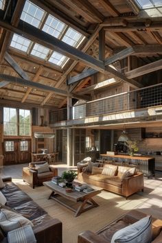 a living room filled with furniture and lots of windows