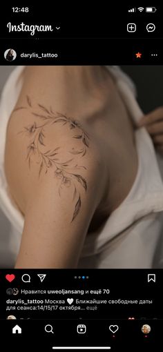 the back of a woman's shoulder with flowers tattooed on her left arm and chest