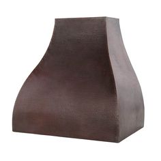 a brown vase sitting on top of a white surface