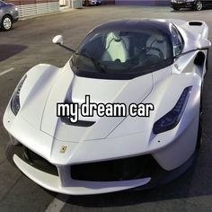 a white sports car with the words my dream car on it's front window