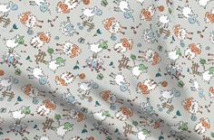 a white fabric with small cartoon animals on it