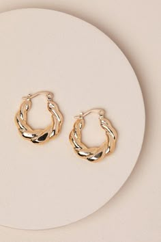 Create the perfect eloquent eloquent vibe every time you add the Lulus Precise Elegance Gold Twisted Hoop Earrings to your look! These versatile earrings have a shiny, gold-toned metal composition that creates a classic hoop silhouette with a trendy twisted design. From casual day 'fits to grand gowns, these earrings are great for any occasion. Hinged post backs. 0. 75" In Diameter. Man Made Materials. Imported. Lulus | Precise Elegance Gold Twisted Hoop Earrings. Gold Hoop Earrings Aesthetic, Grand Gowns, Hoop Earrings Aesthetic, Twisted Hoop Earrings, Earrings Aesthetic, Earrings Hoops, Bride Accessories, Jewelry Lookbook, Trendy Earrings