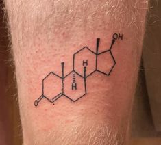 a man with a tattoo on his leg that has the chemical symbol for benze