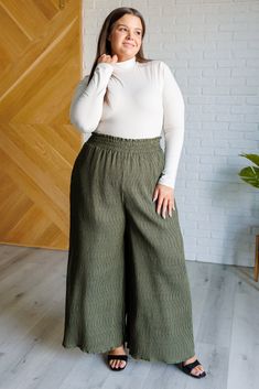 Get ready to make a statement with our Harmony High Rise Wide Leg Pants! Boasting a smocked waistband, textured fabric, and a dramatic wide leg, these iconic pants will make you stand out wherever you go. With a subtle polka dot print, you'll add a touch of glamour to any look. Crinkle Woven High Rise Smocked Elastic Waistband Pockets Wide Leg 100% Polyester True to Size S: Waist 26-30" Hip 46" Rise 13.5" Inseam 27"M: Waist 28-32" Hip 48" Rise 13.5" Inseam 27"L: Waist 30-34" Hip 50" Rise 14" Ins Mock Neck Bodysuit, Dolman Sleeve Tops, Mock Neckline, Denim Leggings, Wide Pants, Romper Dress, Polka Dot Print, Cardigan Jacket, Dress Romper