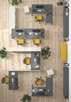 overhead view of an office with desks, chairs and yellow accents on the walls