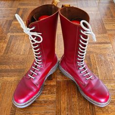 Presenting For Your Consideration....A Beautifully Weathered Pair Of 1914 Tall Boots In Oxblood Red. This 14 Hole Boot Comes With Some Small Scuffs Here And There But Nothing To Be Shamed About. Brown Lace Hardware,Pull Tabs And Welt....Accented By Gold Stitching And Branding. Standing On A Red,Translucent Dms Sole....Full Tread Pattern. These Are Becoming A Thing Of The Past In The Resale Market. Uk5/Us6/W7 Doc Marten Boot, Doc Marten, Oxblood Red, Doc Martens, Moto Boots, Tall Boots, A Thing, The Past, Stitching