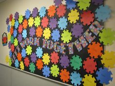 a bulletin board with colorful puzzle pieces on it