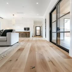 a living room filled with furniture and wooden floors