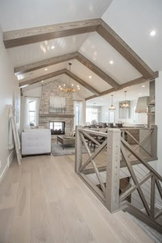 a living room filled with furniture and a fire place in the middle of a room