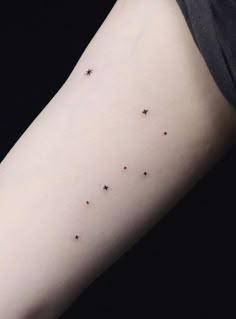 small stars on the right arm and left arm are visible in this photo, with black ink