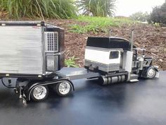 a toy truck with a trailer attached to it