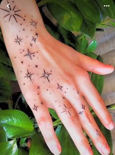 a woman's hand with stars on it