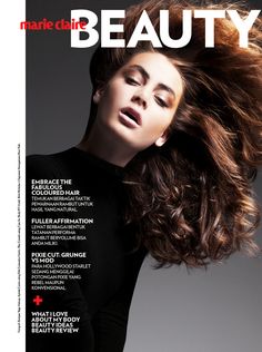 a woman with her hair blowing in the wind on top of a magazine cover that reads, marie claire beauty