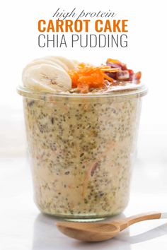 carrot cake chia pudding in a glass jar with spoons and other ingredients around it