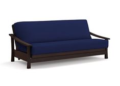 a blue futon couch sitting on top of a white floor next to a wooden frame