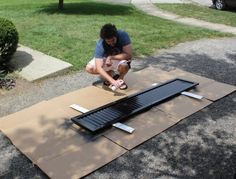 a man working on an outdoor solar panel