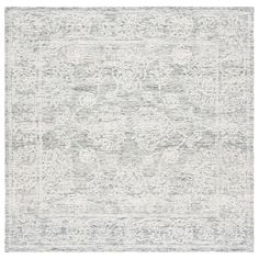 an area rug with grey and white colors