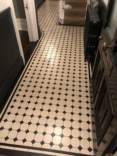 a black and white tiled floor in a bathroom