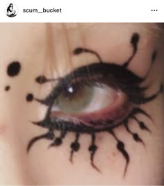 a woman's eye with black ink on her face and the words scum - bucket