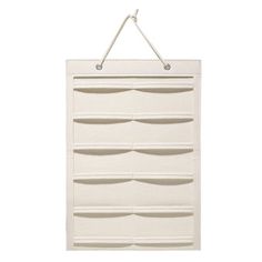 a white wall hanging organizer with six drawers and two hooks on the top of it