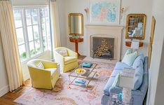 a living room filled with furniture and a fire place